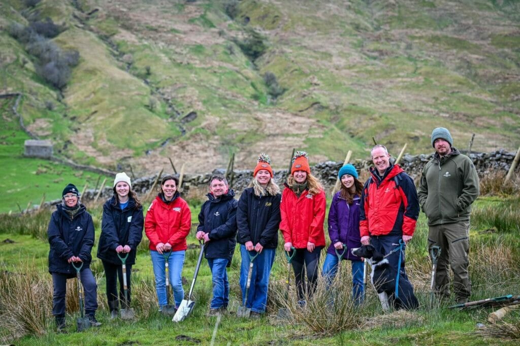 A group of people planting trees in the Yorkshire Dales